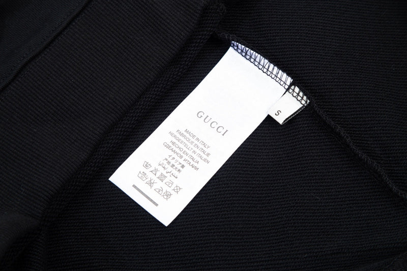 Close-up detail shot of Gucci luxury clothing with tailored silhouette