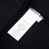 Close-up detail shot of Gucci luxury clothing with tailored silhouette