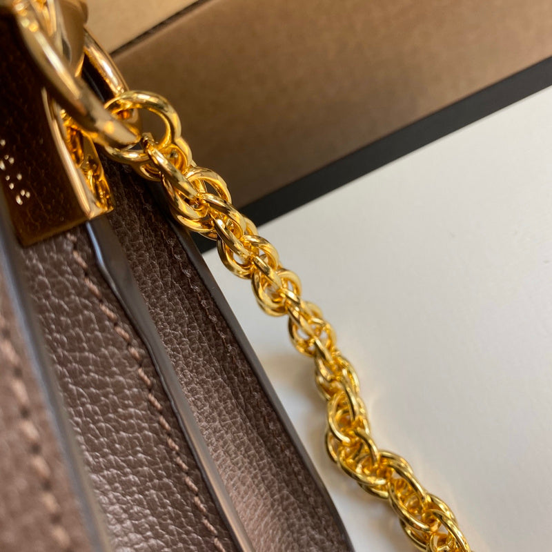 Styled lifestyle shot of polished everyday-luxe women's handbag – women's luxury accessory