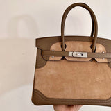  polished top-handle bag detail view showing craftsmanship