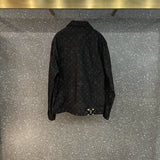 Close-up detail shot of Louis Vuitton luxury clothing with label-forward styling