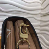 Handle and strap detail of structured polished women's handbag – women's luxury accessory
