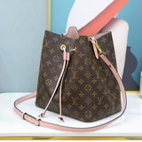 Styled lifestyle shot of signature structured women's handbag – women's luxury accessory