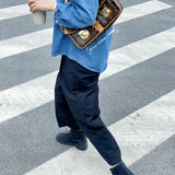  Understated top-handle bag carried on shoulder 10