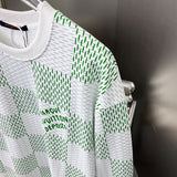 Full styled look of Louis Vuitton luxury clothing with label-forward styling