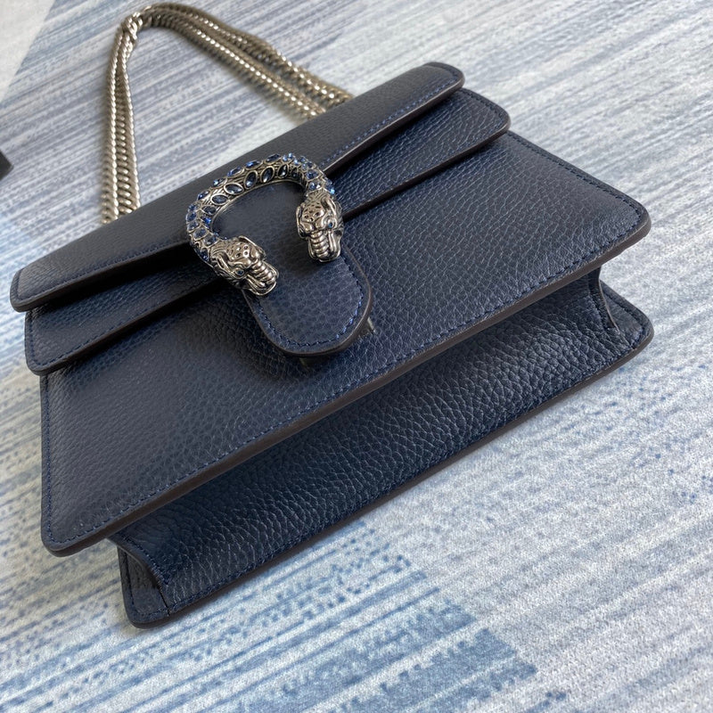 Handle and strap detail of everyday-luxe polished women's handbag – women's designer-style accessory