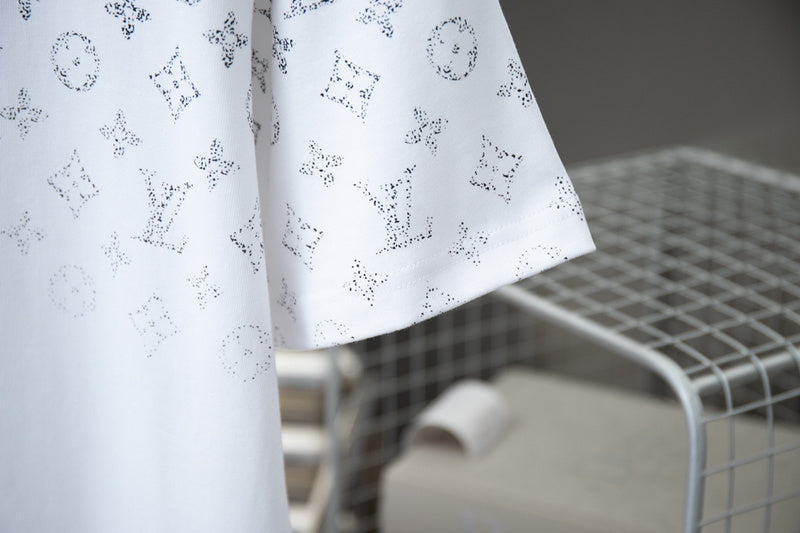 Flat lay presentation of Louis Vuitton cotton t-shirt with signature branding