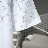 Flat lay presentation of Louis Vuitton cotton t-shirt with signature branding