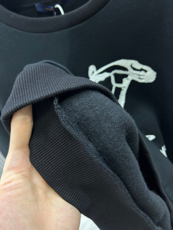 Side profile of Louis Vuitton luxury clothing with label-forward styling