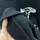 Side profile of Louis Vuitton luxury clothing with label-forward styling