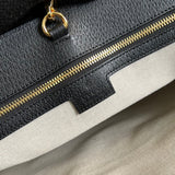 Side profile of elevated chic women's handbag – women's luxury accessory