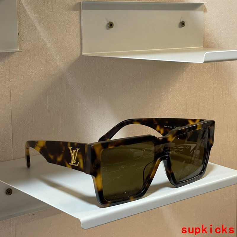 Close-up detail view of Louis Vuitton unisex sunglasses