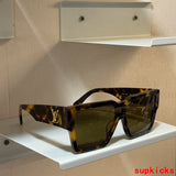 Close-up detail view of Louis Vuitton unisex sunglasses