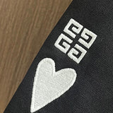 Close-up detail shot of Givenchy luxury clothing with streetwear-inspired cut