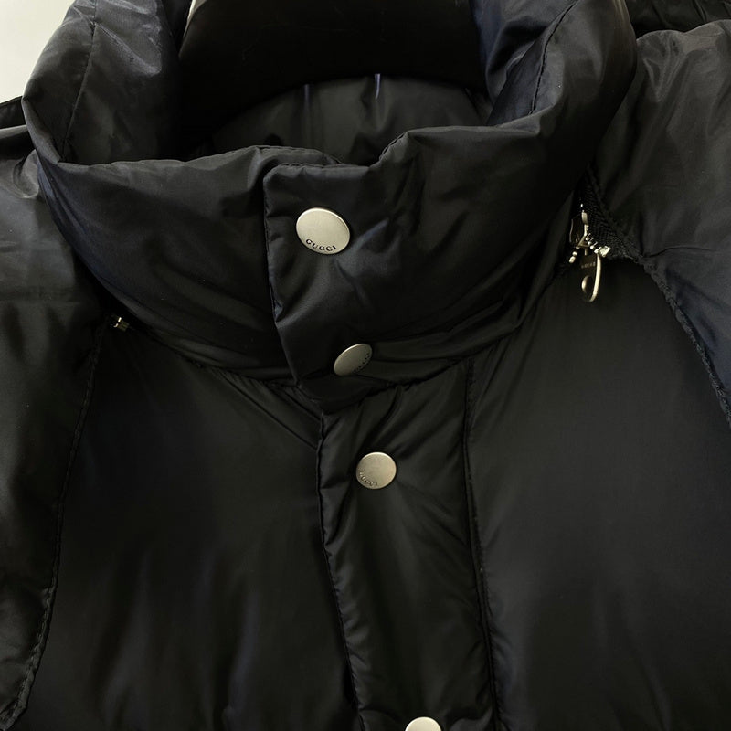 Close-up detail shot of Gucci luxury clothing with runway-inspired design