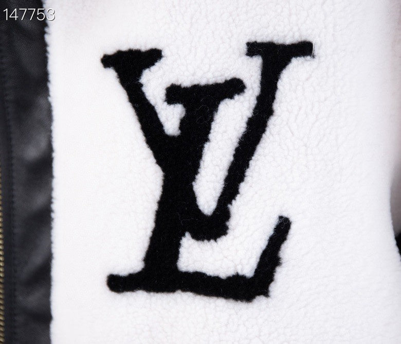Close-up detail shot of Louis Vuitton luxury clothing with signature branding