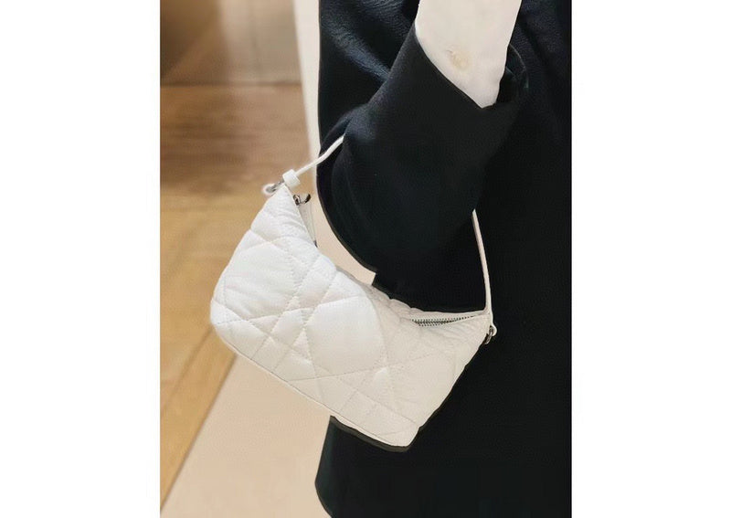 Side profile of polished classic women's handbag – women's premium purse