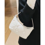 Side profile of polished classic women's handbag – women's premium purse