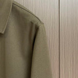 Full styled look of Louis Vuitton luxury clothing with signature branding