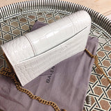 Handle and strap detail of chic polished women's handbag – women's statement bag