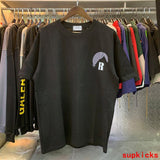 Flat lay presentation of Rhude luxury clothing with contemporary cut