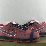 Side profile of Nike tonal black sneakers chunky sole construction