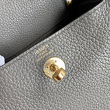 Side view of polished structured handbag