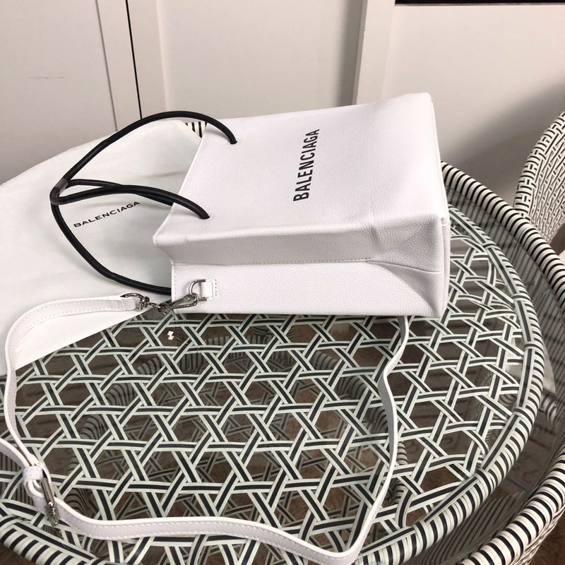 Styled lifestyle shot of structured statement women's handbag – women's luxury handbag