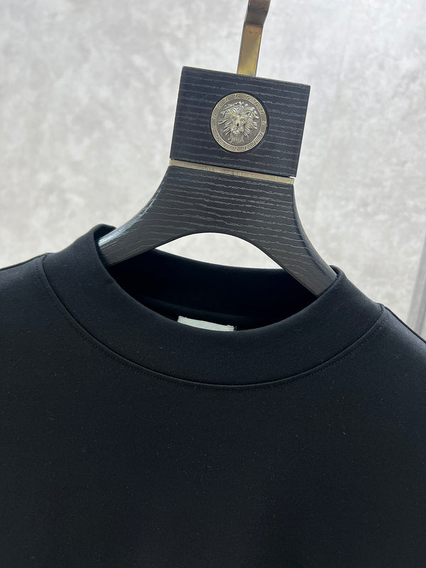 Close-up detail shot of Louis Vuitton luxury clothing with monogram-inspired silhouette