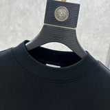 Close-up detail shot of Louis Vuitton luxury clothing with monogram-inspired silhouette