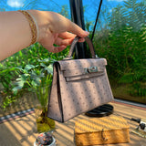  Elegant top-handle bag carried on shoulder 10