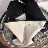 Back view of refined modern women's handbag – women's luxury accessory