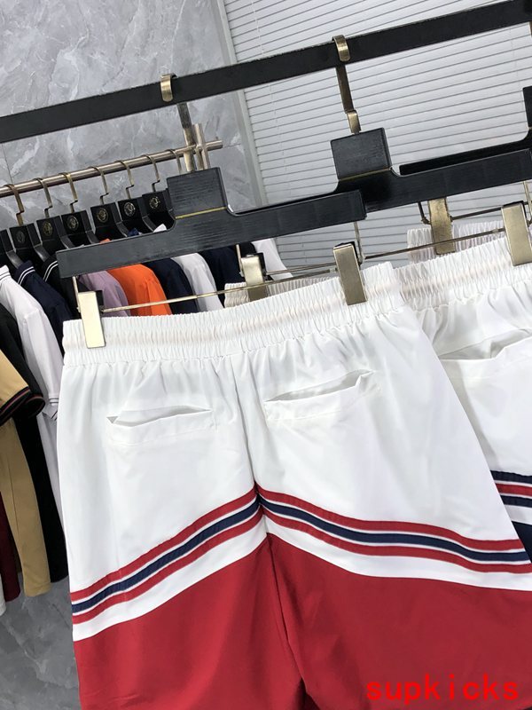 Side profile of Rhude luxury clothing with label-forward styling
