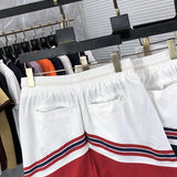 Side profile of Rhude luxury clothing with label-forward styling