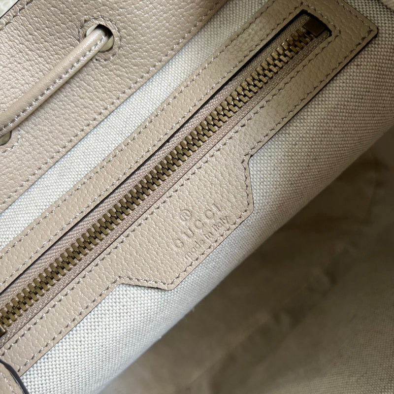 Side profile of polished signature women's handbag – women's premium purse