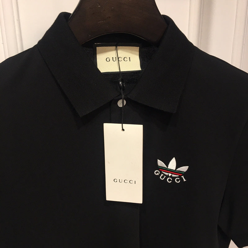 Flat lay presentation of Gucci luxury clothing with monogram-inspired silhouette