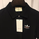 Flat lay presentation of Gucci luxury clothing with monogram-inspired silhouette