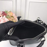 Front view of classic signature women's handbag – women's luxury handbag