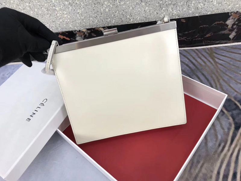 Handle and strap detail of statement polished women's handbag – women's statement bag