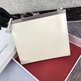 Handle and strap detail of statement polished women's handbag – women's statement bag