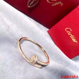 Front view of Cartier unisex jewelry piece