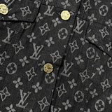 Close-up detail shot of Louis Vuitton luxury clothing with signature branding