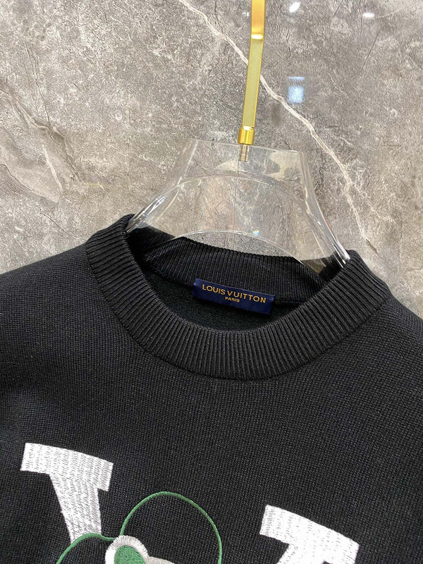 Side profile of Louis Vuitton luxury clothing with label-forward styling