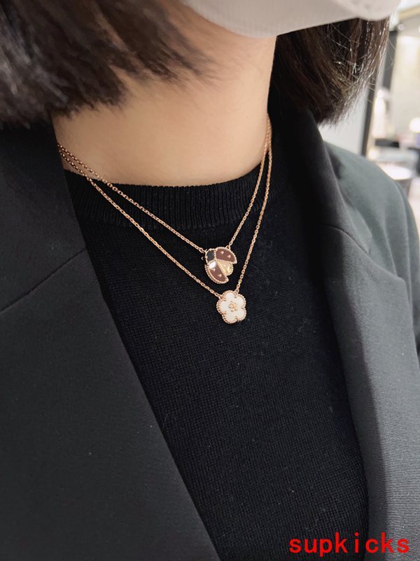 Lifestyle view of Van Cleef & Arpels unisex jewelry piece