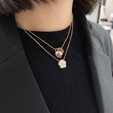 Lifestyle view of Van Cleef & Arpels unisex jewelry piece