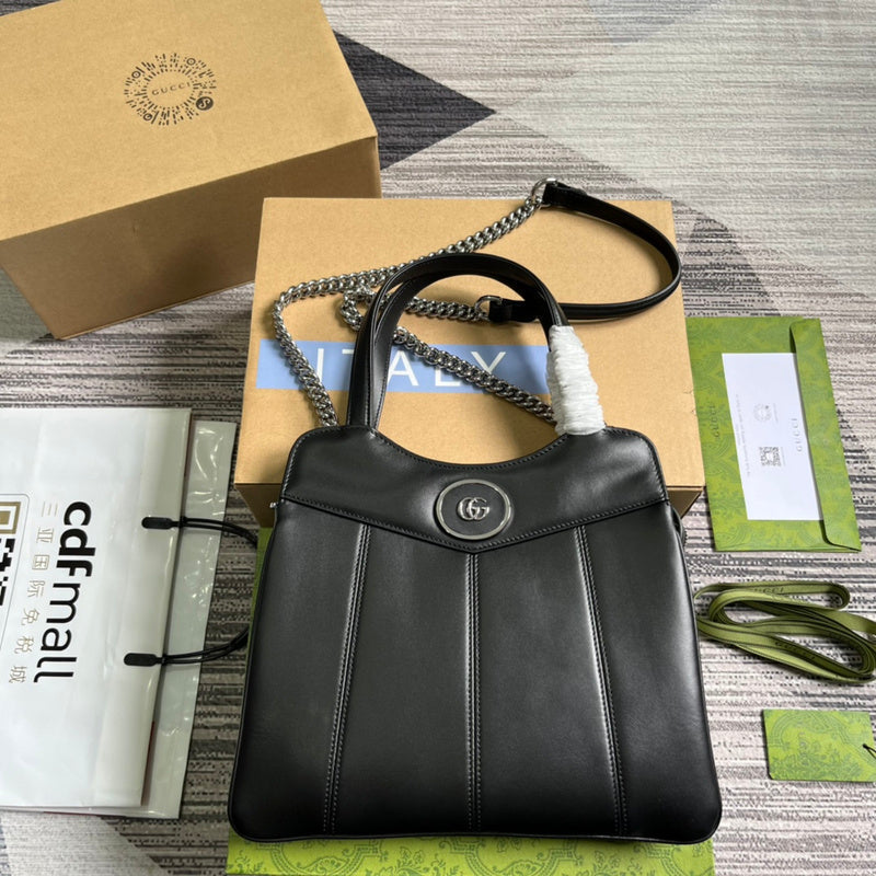 Side profile of statement classic women's handbag – women's luxury accessory