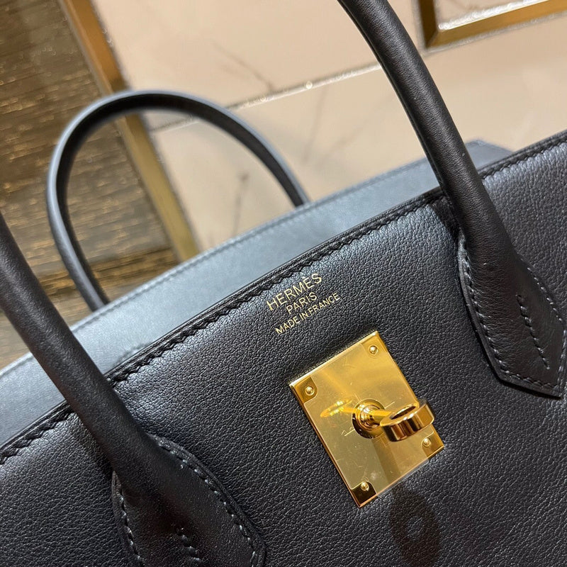 Side view of understated structured handbag