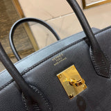 Side view of understated structured handbag