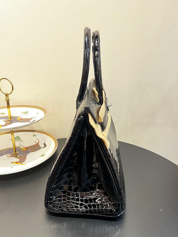 Side view of classic structured handbag