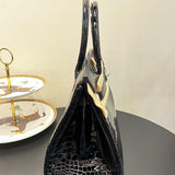 Side view of classic structured handbag